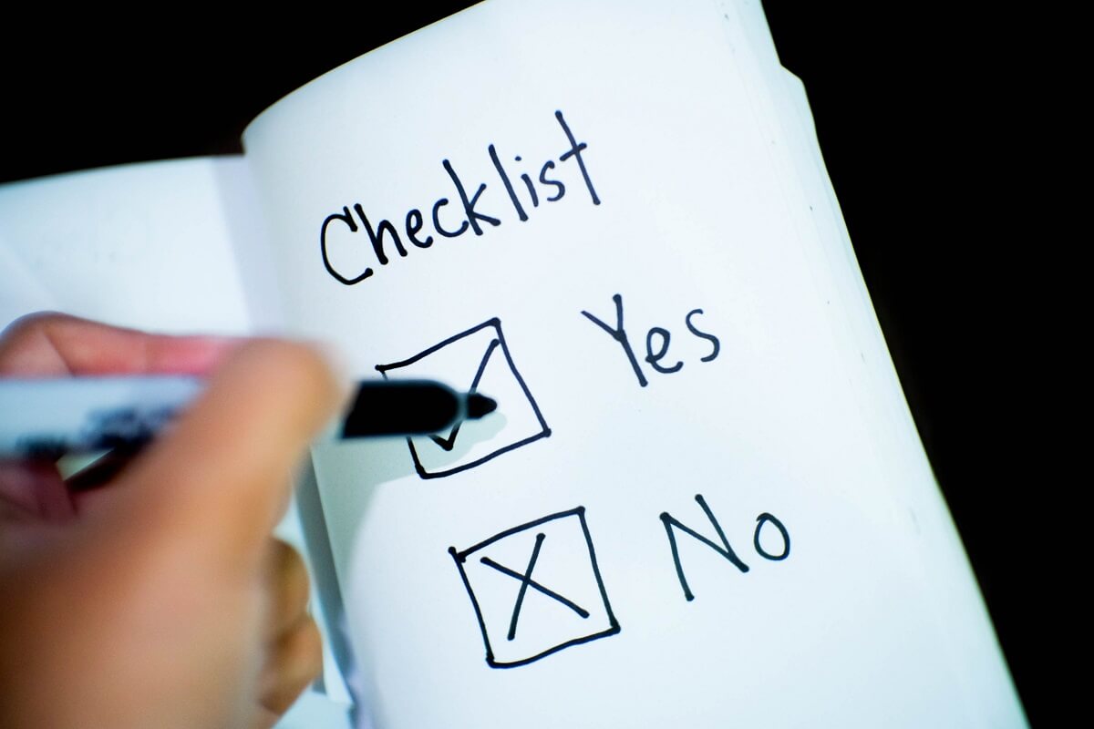 A Yes or No checklist with hand checking both boxes